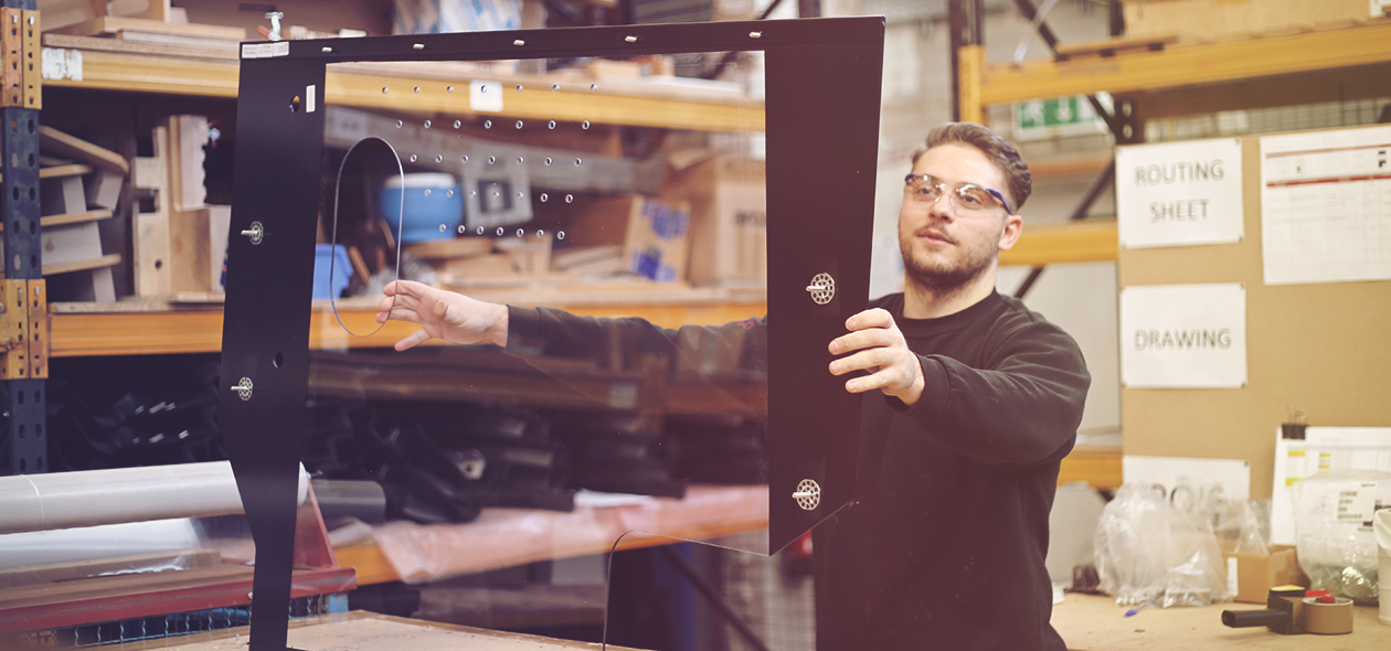 man holding up a plastic frame