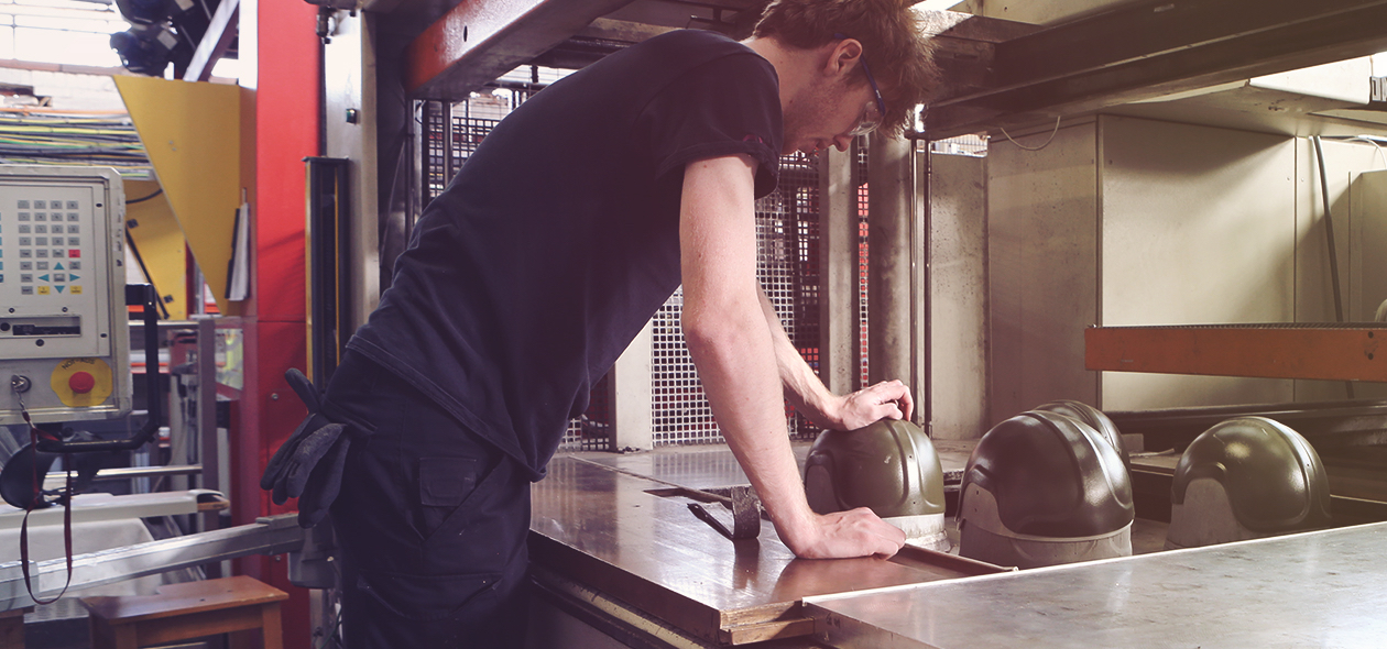 man operating a vacuum forming machine