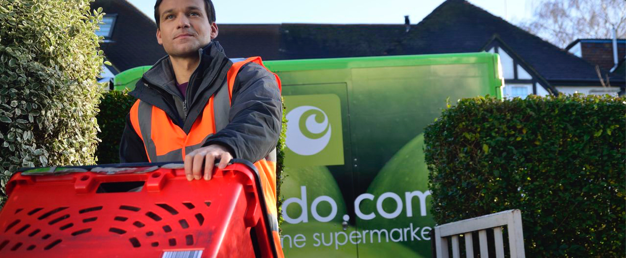 supermarket delivery man carrying a box